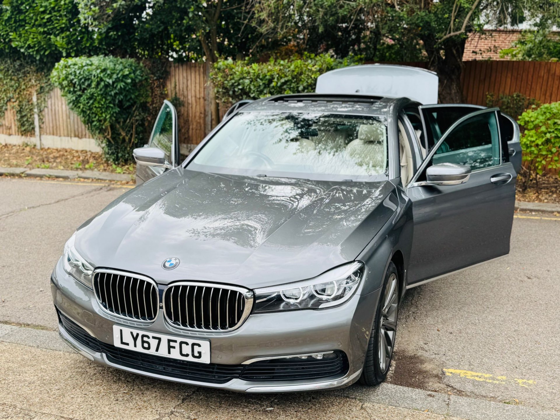 BMW 7 Series front three-quarter with door open