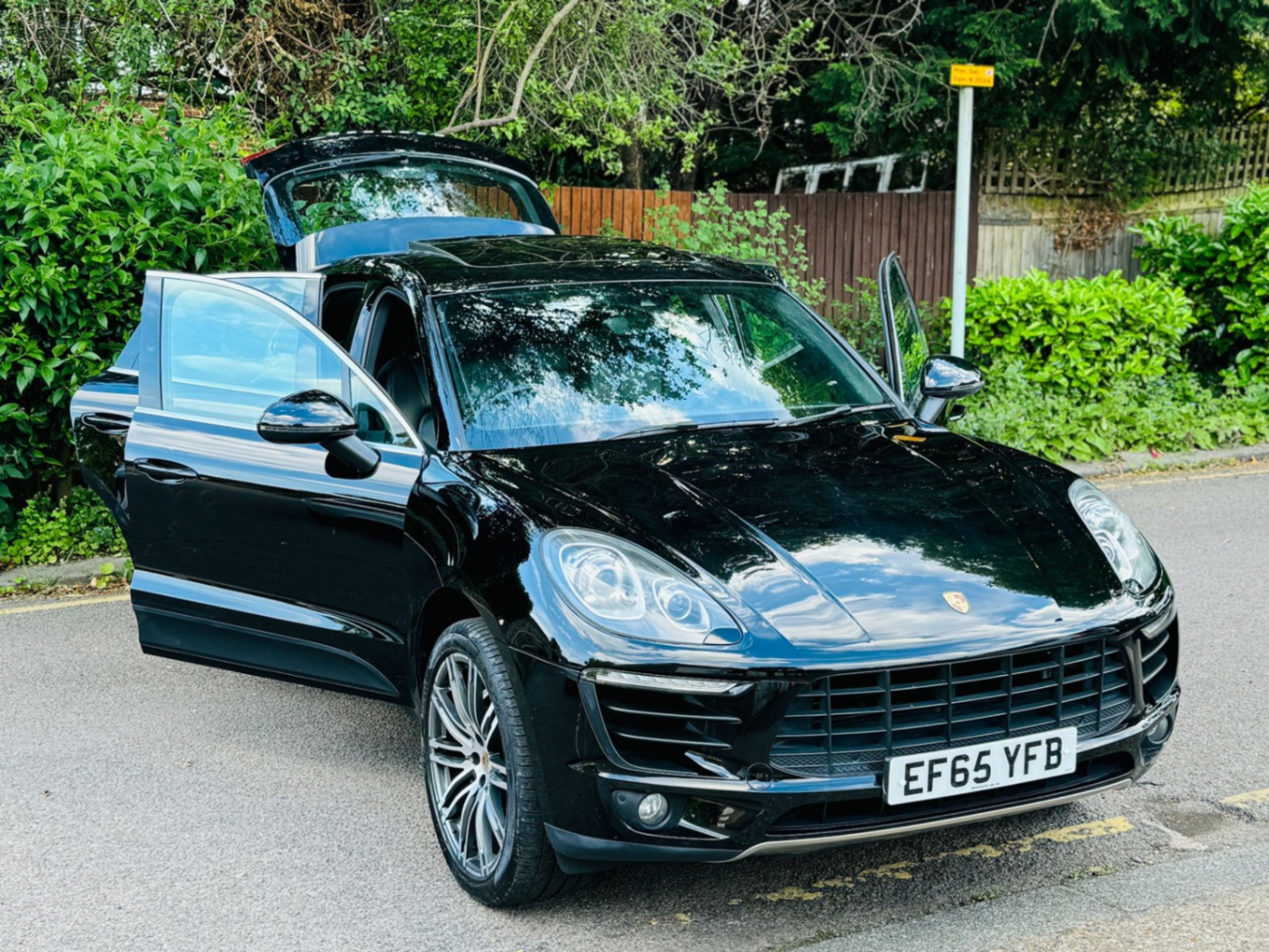 Porsche Macan S front three-quarter with door open